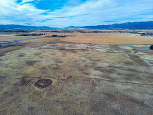 Birds eye view of property with a mountain view