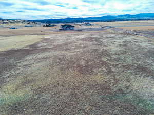 Drone / aerial view with a mountain view and a rural view