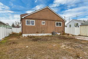 Back of property featuring central air condition unit