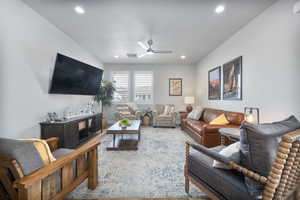 Living room featuring ceiling fan