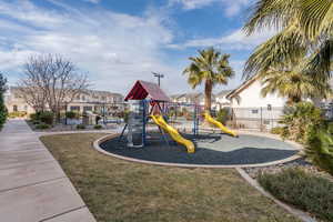 View of jungle gym with a yard