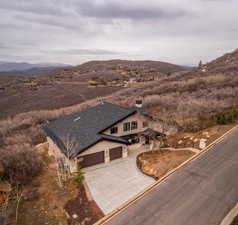 Birds eye view of property with a mountain view