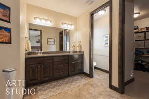 Master bathroom featuring vanity and toilet