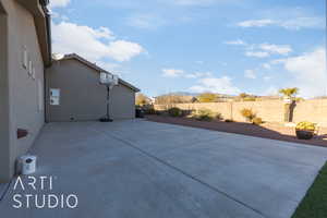 Side yard with basketball hoop behind garage