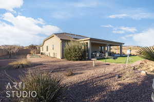 View of side of property featuring 10 fruit trees including 4 apple, 2 peach, 1 pomegranite, 1 nectarine and 2 figs.