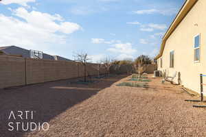 View of side yard featuring 4 apple trees, 2 peach trees, 1 pomegranite tree, 1 nectarine tree and 2 fig trees