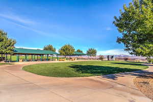 View of community park with a gazebo and large grassy area