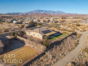 Birds eye view of property with a mountain view and golf course ciew