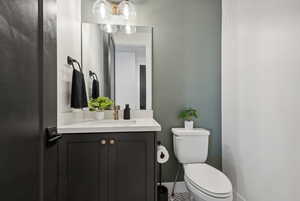 Bathroom featuring vanity and toilet