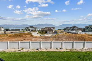 View of yard featuring a water and mountain view