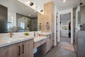 Bathroom with vanity and an enclosed shower