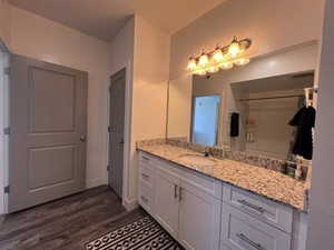 Bathroom with vanity and hardwood / wood-style floors