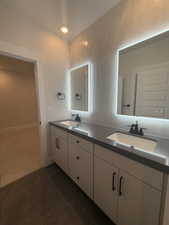 Bathroom featuring tile patterned floors and vanity