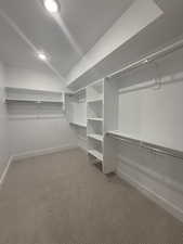 Walk in closet featuring carpet