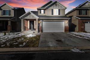 Craftsman-style house featuring a garage