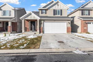 View of front of property with a garage