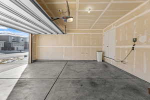 Garage featuring a garage door opener