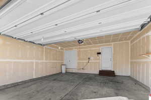 Garage featuring a garage door opener