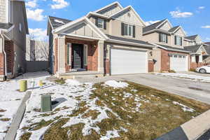 View of front of property featuring a garage