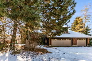 View of front of property featuring a garage