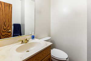 Bathroom featuring vanity and toilet