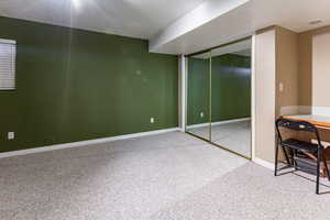 Basement with a textured ceiling