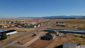 Birds eye view of property with a mountain view