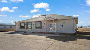 View of front facade featuring french doors