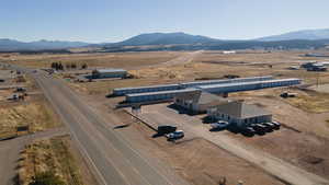 Birds eye view of property featuring a mountain view