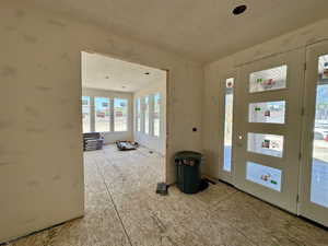 Entrance foyer with a textured ceiling
