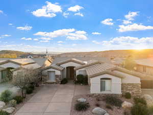 View of front facade featuring a mountain view and a patio