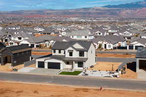 Birds eye view of property with a mountain view