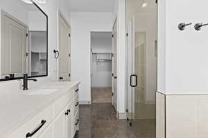 Bathroom with an enclosed shower and vanity