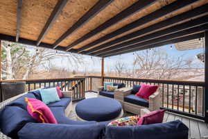 Wooden terrace with an outdoor hangout area