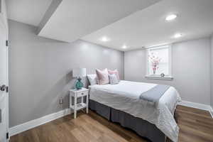 Bedroom with dark wood-type flooring