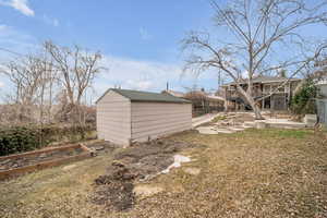 View of yard with a wooden deck