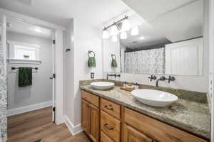 Bathroom with vanity and hardwood / wood-style floors