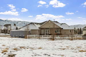 View of front of property featuring a mountain view and french doors