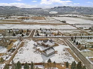 Snowy aerial view featuring a mountain view