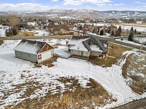 Snowy aerial view with a mountain view