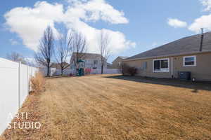 View of yard with central AC