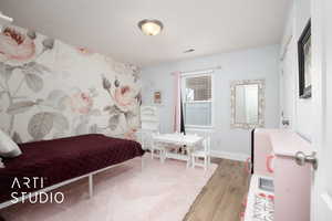 Bedroom featuring light hardwood / wood-style floors