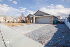 Ranch-style home featuring a garage