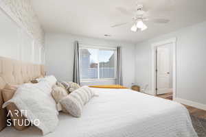 Bedroom featuring hardwood / wood-style flooring and ceiling fan