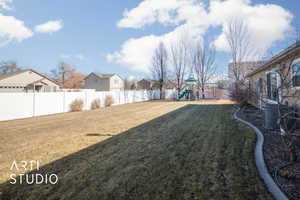 View of yard featuring a playground and cooling unit