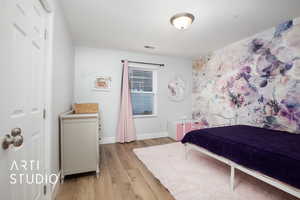 Bedroom featuring light wood-type flooring