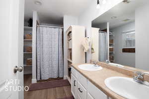 Bathroom with vanity and hardwood / wood-style flooring