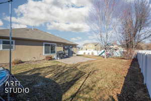 View of yard featuring a patio and a playground