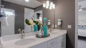 Bathroom with vanity and ceiling fan