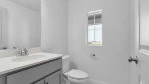 Bathroom with vanity and toilet